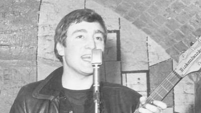 December 1961: Singer, guitarist and songwriter John Lennon (1940 - 1980) of the British group The Beatles live on stage at the Cavern Club in Matthew Street, Liverpool. Getty