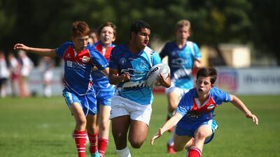 A young player sprints for the try line at the HSBC Rugby Festival at the Sevens Stadium on January 28, 2017 in Dubai, United Arab Emirates. Getty Images