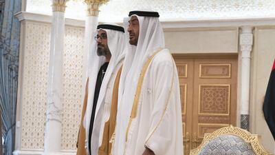 Sheikh Mohamed bin Zayed and Major General Sheikh Khaled bin Mohamed bin Zayed stand for a photograph during a swearing-in ceremony. Ministry of Presidential Affairs