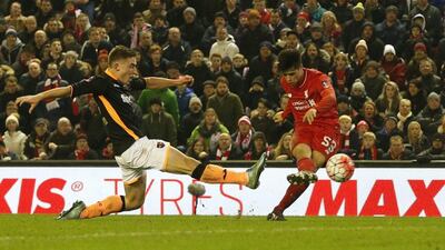 Joao Carlos Teixeira of Liverpool shoots and scores their third goal against Exeter in the FA Cup on Wednesday night. Phil Noble / Reuters