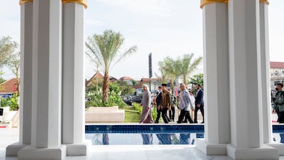 Sheikh Mohamed and Mr Widodo arrive for the opening ceremony.