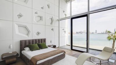 Or lie in bed and wonder at the modern architecture. All of the doors across the property are able to fold back. Courtesy Knight Frank