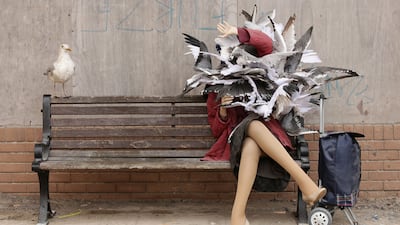 A woman attacked by seagulls. Yui Mok / PA Wire via AP