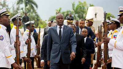 Haiti's President Jovenel Moise, centre, at a ceremony marking the 215th anniversary of revolutionary hero Toussaint Louverture's death, at the National Pantheon Museum in Port-au-Prince, April 2018.