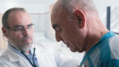 A doctor examining patient with stethoscope. Getty Images