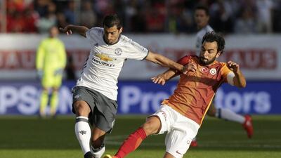 Henrikh Mkhitaryan, left, can provide the goals and creativity lacking from Manchester United last season. Henry Browne / Reuters