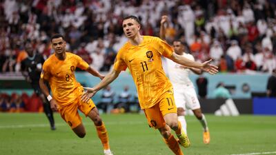 Steven Berghuis of the Netherlands celebrates scoring only for the goal to be ruled out for handball in the build-up. Getty
