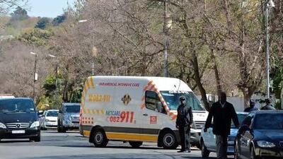 An ambulance carrying Nelson Mandela arrives at his house in Johannesburg.