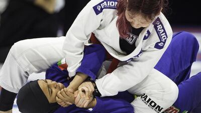 Dinara Muratova of Kazakhstan fights Badreya Ahmed Al Meqbaali of UAE during the teen girls 63kg yellow, orange, green belt semi-final during the Abu Dhabi World Jiu-Jitsu Festival at the IPIC Arena in the Zayed Sport City area of Abu Dhabi on April 11, 2017. Christopher Pike / The National