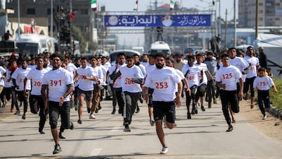 Men compete in a race organised by the UAE-based foundation Al Faris Al Shahm at the Bureij camp for Palestinian refugees in the central Gaza Strip. AFP