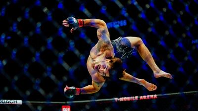 Matthew Semelsberger backflips after defeating Martin Sano Jr. by TKO in the first round of their welterweight fight during UFC 266 at T-Mobile Arena in Las Vegas on September 25. AFP