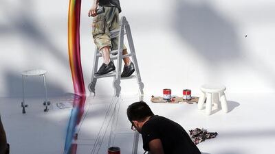 Artist Laurent Hamelin, from France, gives the final touch at the Dubai 3D Art Festival at the Dubai City Walk in Dubai. Satish Kumar / The National