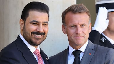 Iraqi Prime Minister Ali Al Zaidi, left, meets French President Emmanuel Macron in Paris. AFP