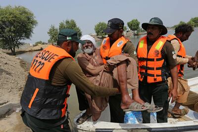 An elderly man is evacuated from a flood affected area in Bahawalnagar of Punjab province on Saturday. AFP