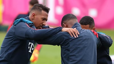 Bayern Munich's Jerome Boateng and teammates do stretching exercises. Reuters