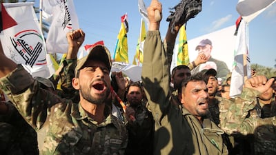 Iraqi PMF militiamen demonstrate during a protest over the killings of Qassem Suleimani and Abu Mahdi Al Muhandis January 6, 2020 in Baghdad. AFP