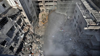 Rescue workers search for people at the site of an Israeli air strike that hit central Beirut. AP