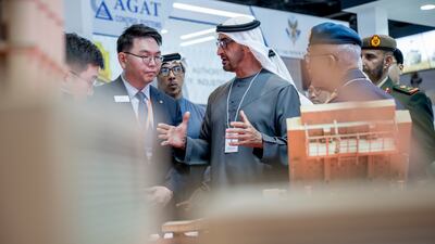 President Sheikh Mohamed visits a booth
