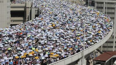 Muslim pilgrims walk on a bridge as they head to cast stones at pillars symbolising Satan during the final day of the annual Haj pilgrimage in Mina on the third day of Eid al-Adha, near the holy city of Mecca. Muhammad Hamed / Reuters