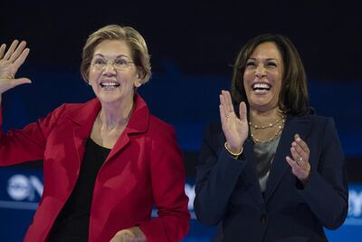 Senator Elizabeth Warren, left, and Senator Kamala Harris stand on stage during the Democratic presidential candidate debate in Houston. Bloomberg