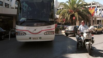 A police escort prepares to take the Manchester United team bus to Athens International Airport after their Champions League game against Olympiakos was called off in September, 2001. Getty