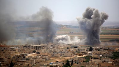 Plumes of smoke rise following Syrian government forces' bombardment on the town of Khan Sheikhoun in Idlib province on June 6, 2019. AFP
