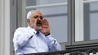 Iranian foreign minister Mohammed Javad Zarif talks to journalists as he stands on the balcony of the Coburg hotel, the venue for nuclear talks, in Vienna on July 13. Reuters