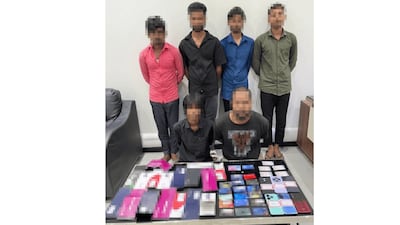 The six people arrested after Dubai Police investigated complaints of unexplained bank account deductions. Photo: Dubai Police