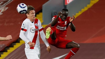 Liverpool's Sadio Mane and Jannik Vestergaard battle for possession during the Premier League match at Anfield on Saturday, May 8. Reuters
