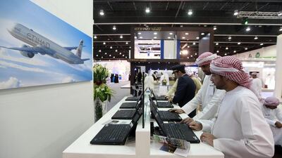 Visitors browse the Etihad Airways stands at the Tawdheef Recruitment Show in Abu Dhabi. Satish Kumar / The National