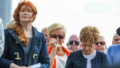 Family members of those killed in the Omagh bombing attack gather at a memorial service in the town on Sunday. AFP