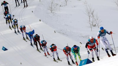 Iivo Niskanen of Finland leads the pack in the men's 50km mass start classic at the 2018 Winter Olympics. Kai Pfaffenbach / Reuters
