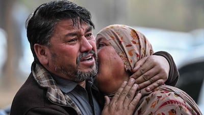 Relatives outside a hospital after the blast. AFP