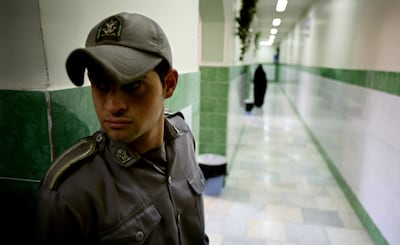 A prison guard stands along a corridor in Tehran's Evin prison. Reuters