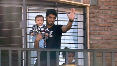 Luis Suarez shown at his mother's home in Uruguay on Friday as he returned home from the 2014 World Cup after being banned from football for four months by Fifa. Pablo Bielli / AFP / June 27, 2014
