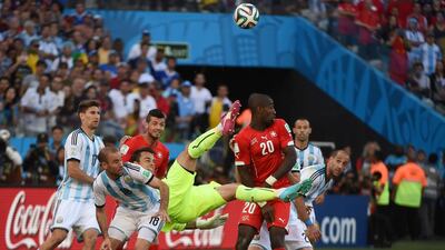 Switzerland goalkeeper Diego Benaglio, centre, attacks during the final minutes of their loss to Argentina on Tuesday at the 2014 World Cup. Christophe Simon / AFP