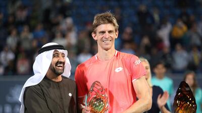 Kevin Anderson, who won the title last year, is presented with the runner-up trophy. But he has once again won the hearts of tennis fans in the capital. Suhaib Salem / Reuters