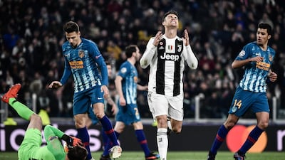 Juventus' Portuguese forward Cristiano Ronaldo, centre, reacts after missing a goal opportunity. AFP