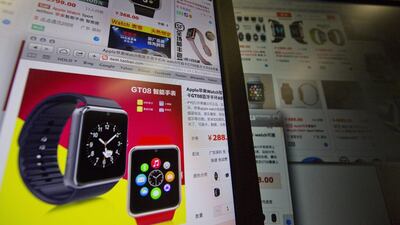 An e-commerce website with a vendor selling the Apple Smart Watch Bluetooth Bracelet starting from 288 yuan (US$45) is displayed on a computer screen in Beijing. Ng Han Guan / AP Photo