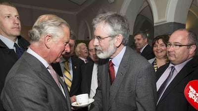 The historic handshake between Prince Charles and Sinn Fein leader Gerry Adams, right, in Galway, Ireland, on Tuesday. It marked the first time a leader of a political party with links to the Irish Republican Army, which killed Lord Mountbatten, had met a senior royal. Adam Gerrard / Reuters