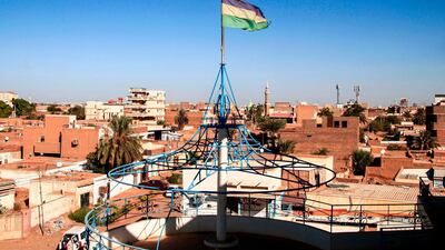 Sudan's independence-era flag, a symbol for the 2019 revolution which toppled former leader Omar Al Bashir, flying in the city of Omdurman. AFP