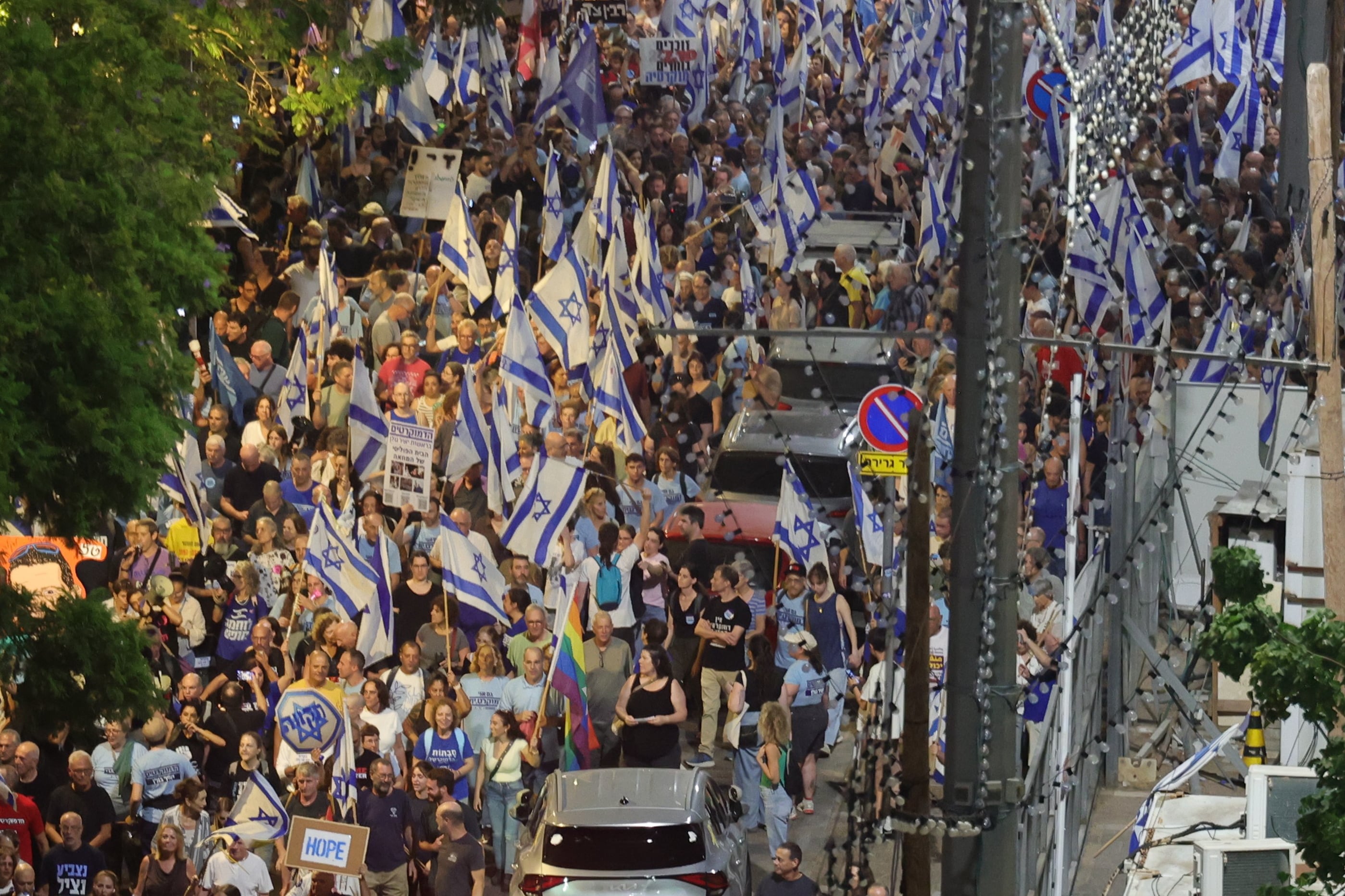 Anti-government demonstrators march in Tel Aviv. EPA