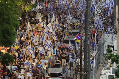 Anti-government demonstrators march in Tel Aviv. EPA