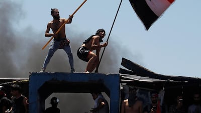 Demonstrators gesture as they take part in the ongoing anti-government protests after newly-appointed Iraqi Prime Minister Mustafa Kadhimi called for the release of all detained protesters, at Al Jumhuriya bridge in Baghdad, Iraq. REUTERS