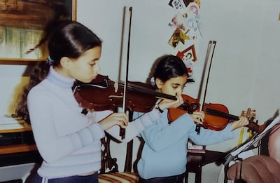 Once they started lessons, Sarah and Laura, above aged nine and six in their house in Glasgow, took to learning music quickly, as if it were a puzzle. Photo: The Ayoub Sisters