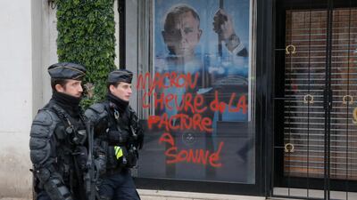 French policemen patrol the Champs Elysees on November 25, 2018, a day after violent protests on the famous avenue. AP Photo