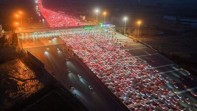 Vehicles merge onto expressway lanes after passing through the Wuzhuang toll station in Chuzhou, eastern China's Anhui Province at the end of the Spring Festival holiday marking the Year of the Horse. AFP