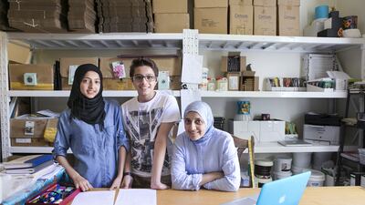 Serial entrepreneur Fatima Paruk with her children Husna, who is not keen on joining an SME when she graduates, and Mohammed. Reem Mohammed / The National