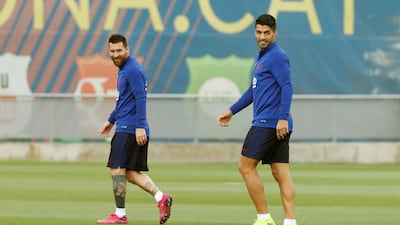 Lionel Messi, left, and strike partner Luis Suarez. EPA