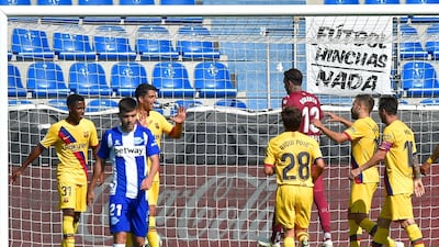 Barcelona forward Luis Suarez (3L) celebrates scoring the third goal. AFP